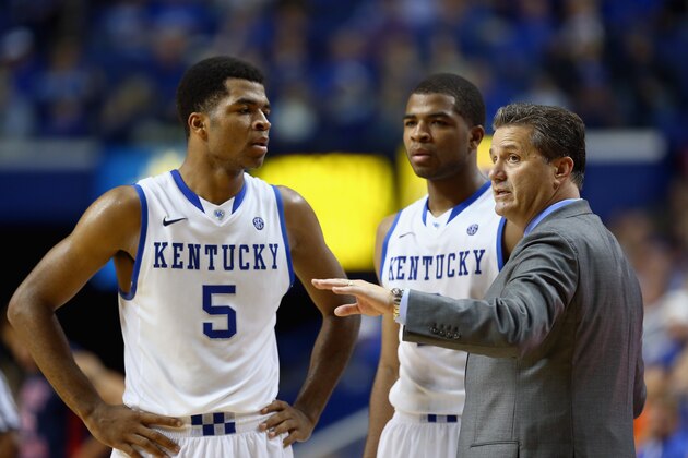 LEXINGTON, KY - NOVEMBER 17:  John Calipari the head coach of the Kentucky Wildcats gives instructions to Andrew Harrison #5 and Aaron Harrison #2 during the game against the Robert Morris Colonials at Rupp Arena on November 17, 2013 in Lexington, Kentucky.  (Photo by Andy Lyons/Getty Images)