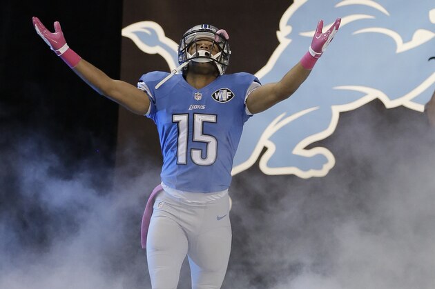 Detroit Lions wide receiver Golden Tate (15) is introduced before an NFL football game against the Buffalo Bills Sunday, Oct. 5, 2014, in Detroit. (AP Photo/Duane Burleson)