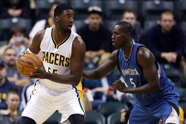Oct 7, 2014; Indianapolis, IN, USA; Indiana Pacers center Roy Hibbert (55) posts up against Minnesota Timberwolves center Gorgui Dieng (5) at Bankers Life Fieldhouse. Mandatory Credit: Brian Spurlock-USA TODAY Sports