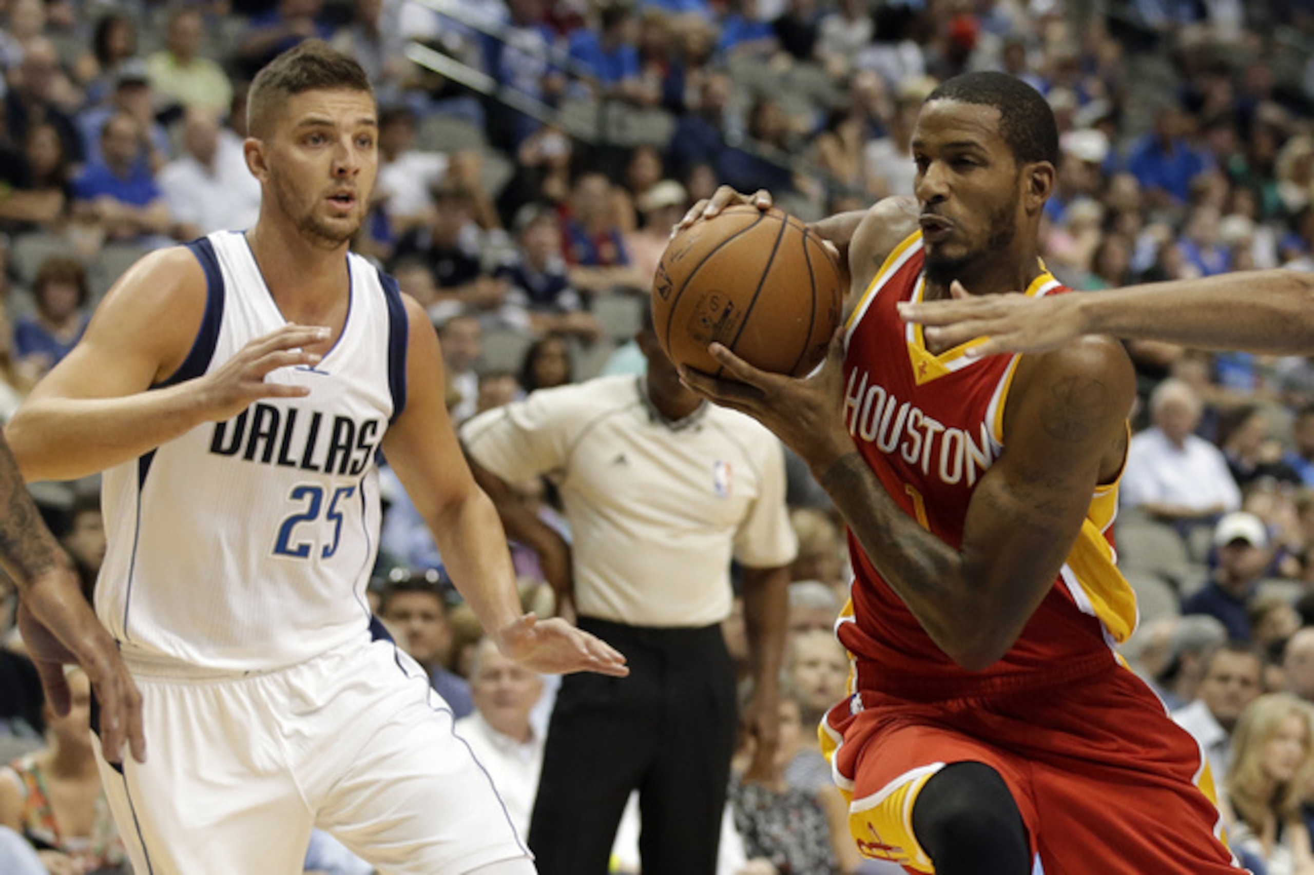 Dallas Mavericks' Chandler Parsons (25) and Devin Harris (20) defend as Houston Rockets guard Trevor Ariza, center, moves to the basket in the first half of a preseason NBA basketball game, Tuesday, Oct. 7, 2014, in Dallas. (AP Photo/Tony Gutierrez) Dallas Mavericks' Chandler Parsons (25) and Devin Harris (20) defend as Houston Rockets guard Trevor Ariza, center, moves to the basket in the first half of a preseason NBA basketball game, Tuesday, Oct. 7, 2014, in Dallas. (AP Photo/Tony Gutierrez)