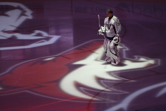 Nashville Predators' Pekka Rinne (35), of Finland, stands in the projection of the Phoenix Coyotes logo prior to the start  of an NHL hockey game Wednesday, April 7, 2010, in Glendale, Ariz.  The Coyotes defeated the Predators 5-2. (AP Photo/Ross D. Franklin)