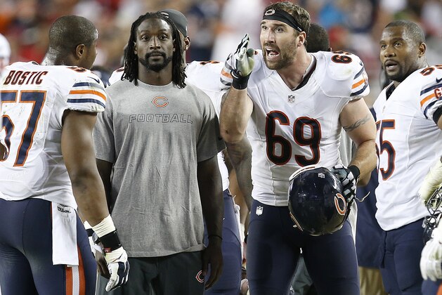 Chicago Bears defensive end Jared Allen (69) talks with inside linebacker Jon Bostic (57), cornerback Charles Tillman, second from left, and outside linebacker Lance Briggs (55) during an NFL football game against the San Francisco 49ers in Santa Clara, Calif., Sunday, Sept. 14, 2014. (AP Photo/Tony Avelar)