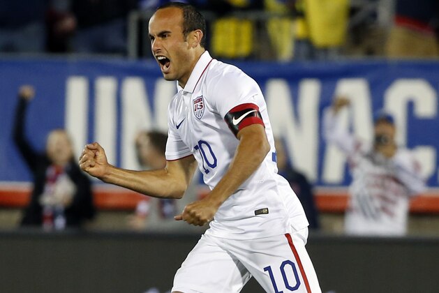 United States' Landon Donovan celebrates his teammate Mix Diskerud's goal in the first half of an exhibition soccer match against Ecuador in East Hartford, Conn., Friday, Oct. 10, 2014. Donovan was making his last international soccer appearance. (AP Photo/Elise Amendola)