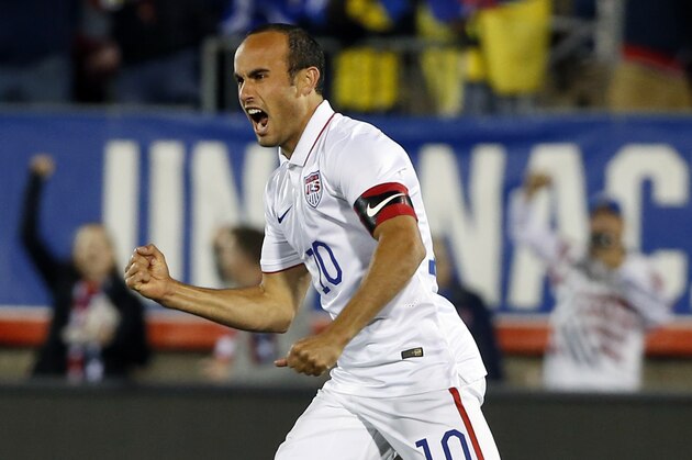 United States' Landon Donovan celebrates his teammate Mix Diskerud's goal in the first half of an exhibition soccer match against Ecuador in East Hartford, Conn., Friday, Oct. 10, 2014. Donovan was making his last international soccer appearance. (AP Photo/Elise Amendola)