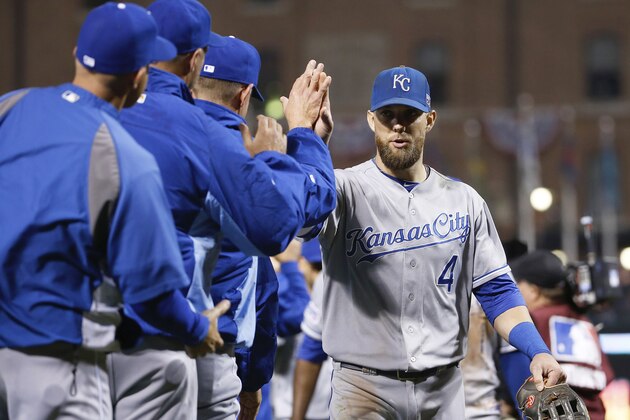Kansas City Royals' Alex Gordon (4) greets teammates after the Royals defeated the against the Baltimore Orioles, 8-6, in Game 1 of the American League baseball championship series Saturday, Oct. 11, 2014, in Baltimore. (AP Photo/Matt Slocum )