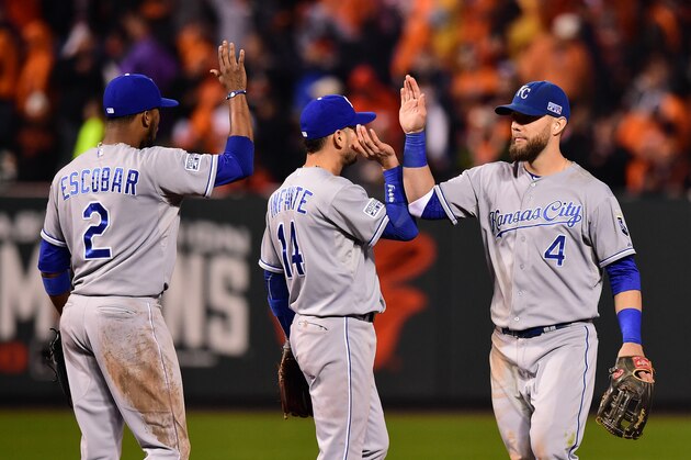 BALTIMORE, MD - OCTOBER 10:  Alex Gordon #4 of the Kansas City Royals celebrates with his teammates Omar Infante #14 and Alcides Escobar #2 after defeating the Baltimore Orioles 8 to 6 in Game One of the American League Championship Series at Oriole Park at Camden Yards on October 10, 2014 in Baltimore, Maryland.  (Photo by Patrick Smith/Getty Images)