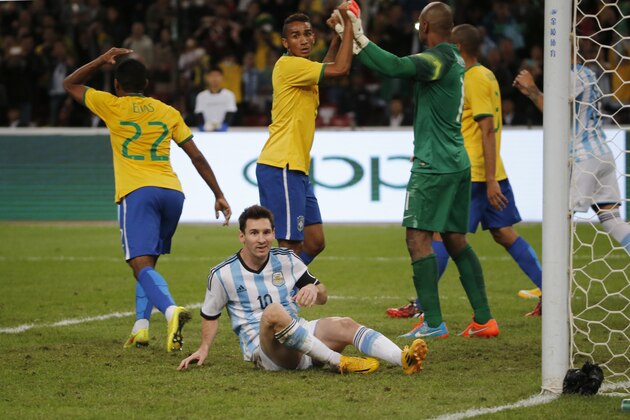 Brazil's players react after Argentina's Lionel Messi, center, missed a chance to score  during a Brazil vs. Argentina friendly match at the Bird's Nest National Stadium in Beijing, China, Saturday, Oct. 11, 2014. (AP Photo/Ng Han Guan)