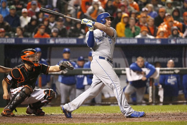 Kansas City Royals' Mike Moustakas (8) watches his two-run home run during the 10th inning of Game 1 of the American League baseball championship series against the Baltimore Orioles Saturday, Oct. 11, 2014, in Baltimore. (AP Photo/Alex Brandon)