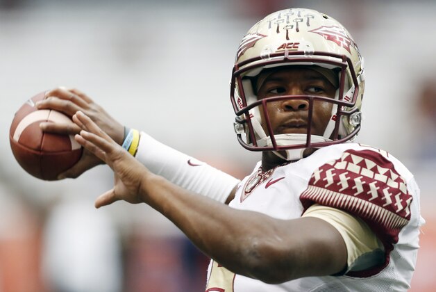 Florida State quarterback Jameis Winston (5) warms up before an NCAA college football game against Syracuse on Saturday, Oct. 11, 2014, in Syracuse, N.Y. (AP Photo/Mike Groll)