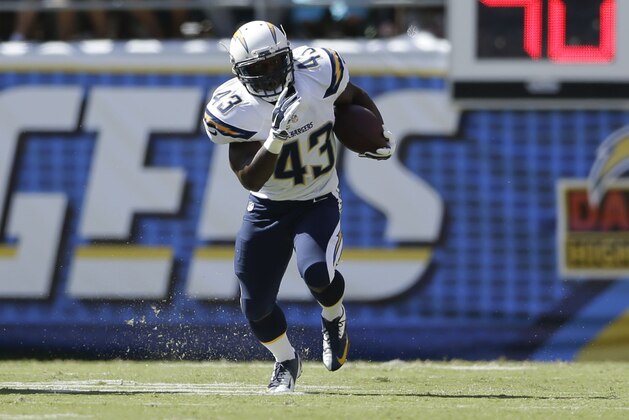 San Diego Chargers running back Branden Oliver runs upfield against the Jacksonville Jaguars during the first half of an NFL football game Sunday, Sept. 28, 2014, in San Diego.  (AP Photo/Gregory Bull)