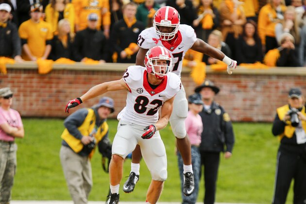 COLUMBIA, MO - OCTOBER 11:  Michael Bennett #82 celebrates with Nick Chubb #27 of the Georgia Bulldogs after Michael Bennett scored the second touchdown of the game against the Missouri Tigers in the second quarter on October 11, 2014 at Faurot Field/Memorial Stadium in Columbia, Missouri. (Photo by Kyle Rivas/Getty Images)