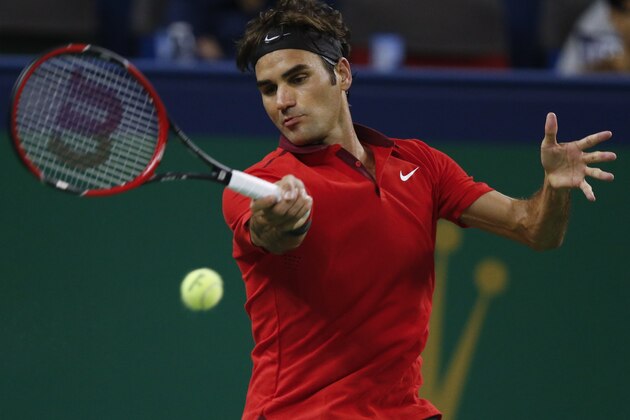 Roger Federer of Switzerland returns a shot to Leonardo Mayer of Argentina during their men's singles second round match at the Shanghai Masters Tennis Tournament in Shanghai, China, Wednesday, Oct. 8, 2014. (AP Photo/Vincent Thian)