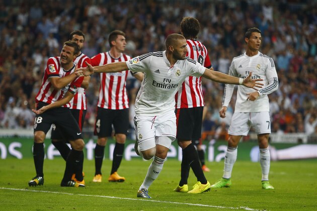 Real's Karim Benzema,  foreground celebrates his goal during a Spanish La Liga soccer match between Real Madrid and Athletic Bilbao at the Santiago Bernabeu stadium in Madrid, Spain, Sunday, Oct. 5, 2014. (AP Photo/Andres Kudacki)