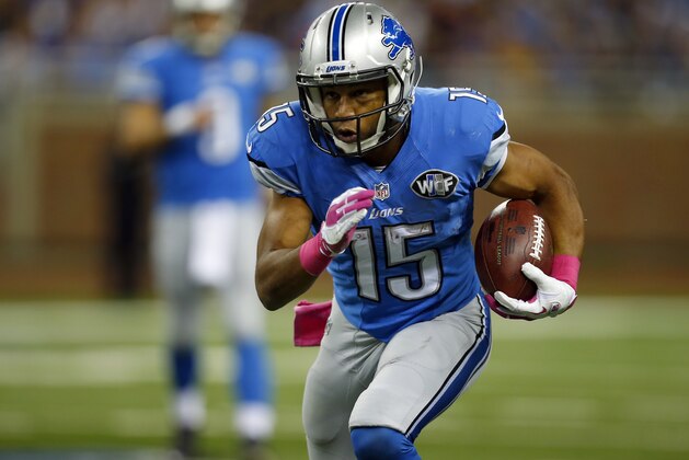 Detroit Lions wide receiver Golden Tate (15) runs after catching a pass against the Buffalo Bills during an NFL game at Ford Field in Detroit on Sunday, Oct. 5, 2014. (Jeff Haynes/AP Images for Panini)