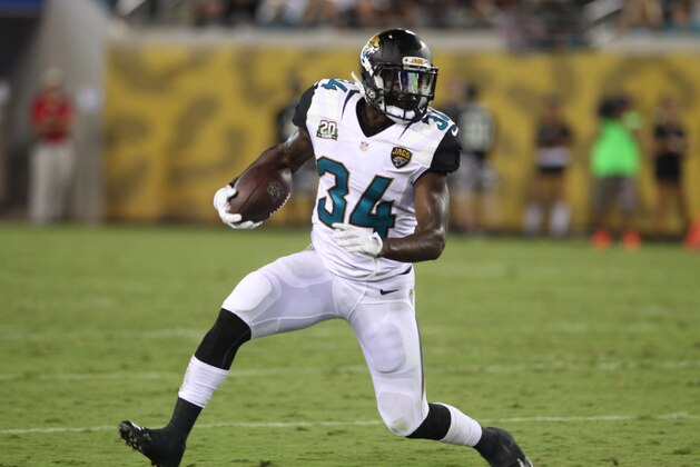 Running Back Storm Johnson #34 of the Jacksonville Jaguars runs the ball during a Pre-Season NFL football game against the Tampa Bay Buccaneers, Friday, Aug. 8, 2014, in Jacksonville, Fla. (Photo by Marc Serota/Panini/AP Images)