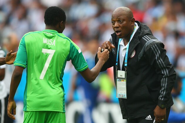 PORTO ALEGRE, BRAZIL - JUNE 25: Ahmed Musa of Nigeria celebrates scoring his team's second goal and his second of the game with head coach Stephen Keshi during the 2014 FIFA World Cup Brazil Group F match between Nigeria and Argentina at Estadio Beira-Rio on June 25, 2014 in Porto Alegre, Brazil.  (Photo by Paul Gilham/Getty Images)