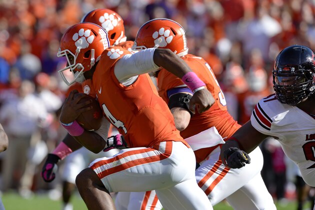 Clemson quarterback Deshaun Watson rushes out of the pocket during an NCAA college football game against Louisville  in Clemson, S.C.,  Saturday, Oct. 11, 2014. (AP Photo/ Richard Shiro)