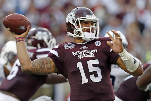 Mississippi State quarterback Dak Prescott (15) throws a pass during the first half of an NCAA college football game against Auburn  in Starkville, Miss., Saturday, Oct 11, 2014.  (AP Photo/Rogelio V. Solis)