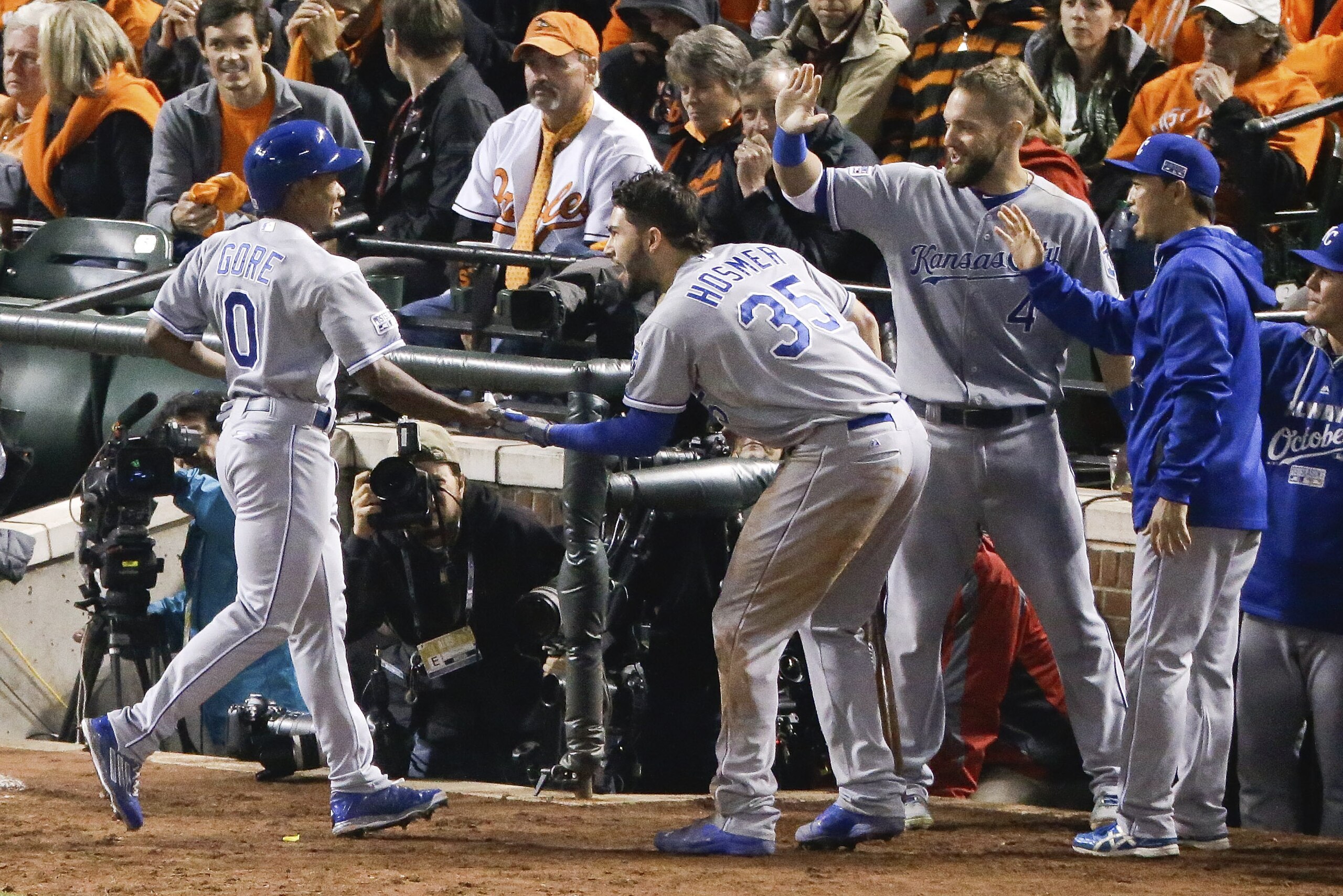 Kansas City Royals' Terrance Gore (0) is congratulated by Eric Hosmer after scoring during the ninth inning of Game 2 of the American League baseball championship series against the Baltimore Orioles Saturday, Oct. 11, 2014, in Baltimore. (AP Photo/Charlie Riedel) Kansas City Royals' Terrance Gore (0) is congratulated by Eric Hosmer after scoring during the ninth inning of Game 2 of the American League baseball championship series against the Baltimore Orioles Saturday, Oct. 11, 2014, in Baltimore. (AP Photo/Charlie Riedel)