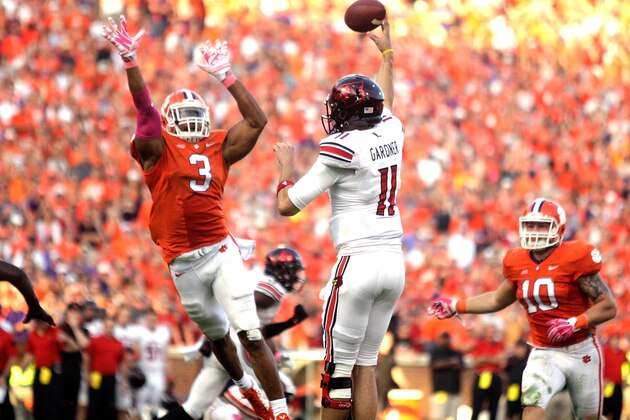 CLEMSON, SC - OCTOBER 11: Vic Beasley #3 of the Clemson Tigers attempts to block a pass by Will Gardner #11 of the Louisville Cardinals during the game at Memorial Stadium on October 11, 2014 in Clemson, South Carolina. (Photo by Tyler Smith/Getty Images)