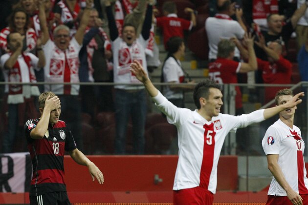 Germany's Toni Kroos touches is forehead after Poland won 2-0 during a Euro 2016 group D qualifying soccer match between Poland and Germany in Warsaw, Poland,Saturday, Oct. 11, 2014. (AP Photo/Czarek Sokolowski)