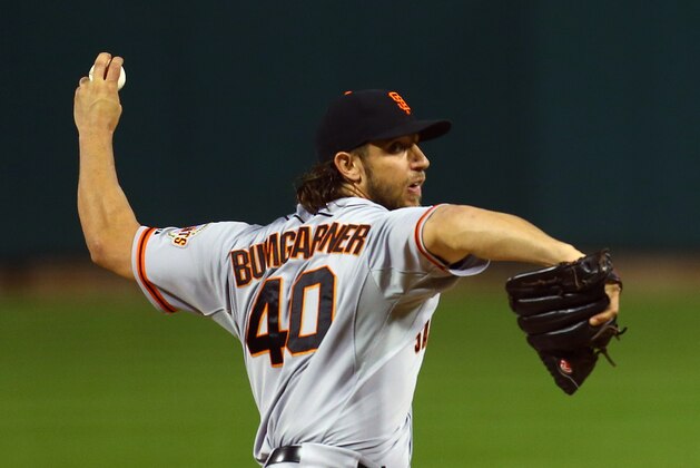 San Francisco Giants starting pitcher Madison Bumgarner throws during the first inning of Game 1 of the National League baseball championship series against the St. Louis Cardinals Saturday, Oct. 11, 2014, in St. Louis. (AP Photo/Dilip Vishwanat, Pool)