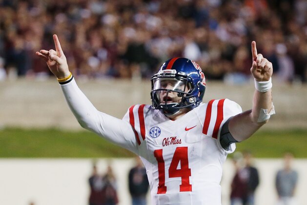 COLLEGE STATION, TX - OCTOBER 11:  Bo Wallace #14 of the Mississippi Rebels celebrates after tossing a 33-yard third quarter touchdown pass during their game against the Texas A&M Aggies at Kyle Field on October 11, 2014 in College Station, Texas.  (Photo by Scott Halleran/Getty Images)