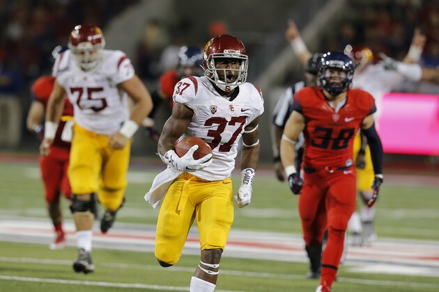 Southern California running back Javorius Allen (37) runs for his second touchdown during the first half of an NCAA college football game against Arizona, Saturday, Oct. 11, 2014, in Tucson, Ariz. (AP Photo/Rick Scuteri)