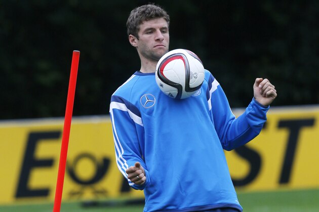 Thomas Mueller juggles with the ball during a training session of Germany's national soccer team in Frankfurt, Germany, Wednesday, Oct. 8, 2014. Germany will play against Poland in a group D qualifying match for the Euro 2016 in Warsaw next Saturday. (AP Photo/Michael Probst)