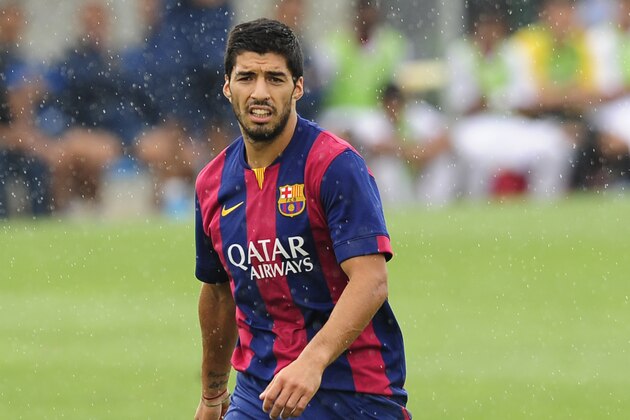 FC Barcelona's Luis Suarez, from Uruguay, looks on during a friendly soccer match between FC Barcelona B and Indonesia  under-19 national team at the Sports Center FC Barcelona Joan Gamper in San Joan Despi, Spain, Wednesday, Sept. 24, 2014. (AP Photo/Manu Fernandez)