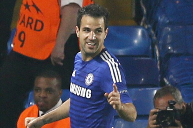 Chelsea's Cesc Fabregas celebrates after scoring the opening goal during the Champions League group G soccer match between Chelsea and Schalke 04 at Stamford Bridge stadium in London, Wednesday, Sept. 17, 2014. (AP Photo/Alastair Grant)
