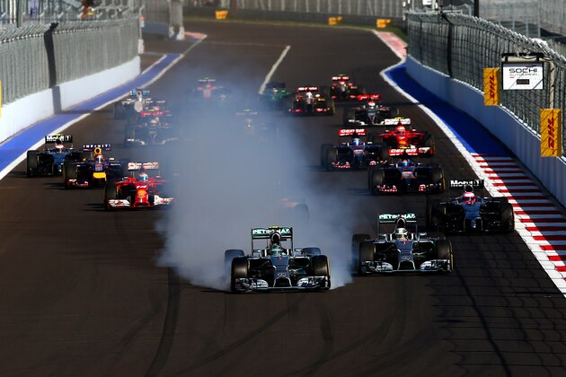 SOCHI, RUSSIA - OCTOBER 12:  Nico Rosberg of Germany and Mercedes GP locks up approaching turn two next to Lewis Hamilton of Great Britain and Mercedes GP during the Russian Formula One Grand Prix at Sochi Autodrom on October 12, 2014 in Sochi, Russia.  (Photo by Mark Thompson/Getty Images)