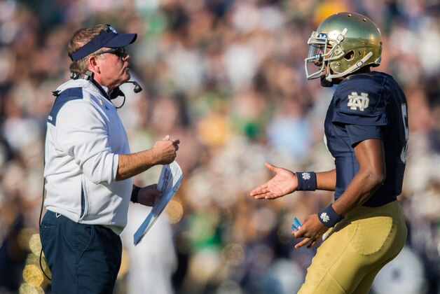 Oct 11, 2014; South Bend, IN, USA; Notre Dame Fighting Irish head coach Brian Kelly talks with quarterback Everett Golson (5) in the second quarter against the North Carolina Tar Heels at Notre Dame Stadium. Mandatory Credit: Matt Cashore-USA TODAY Sports
