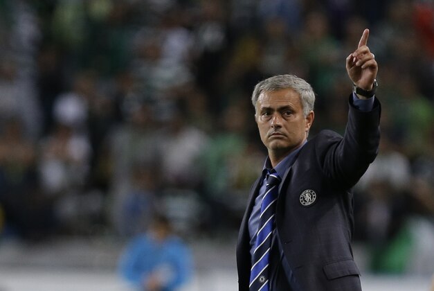 Chelsea's head coach Jose Mourinho celebrates his side's 1-0 win at the end of a Champions League, Group G soccer match between Sporting and Chelsea, in Lisbon, Tuesday, Sept. 30, 2014. (AP Photo/Francisco Seco)