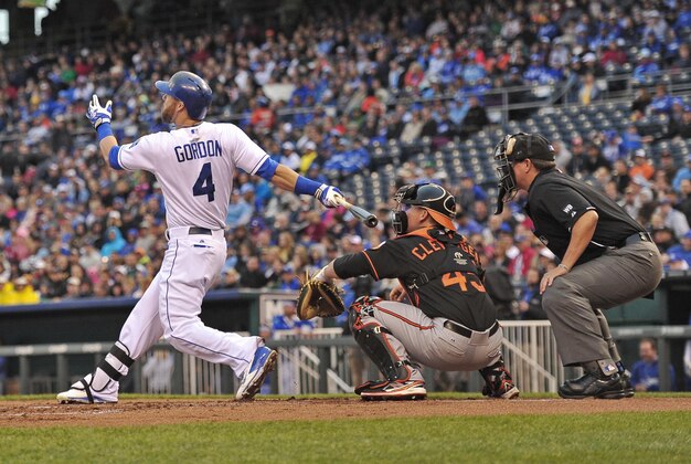 May 16, 2014; Kansas City, MO, USA; Kansas City Royals left fielder Alex Gordon (4) at bat against the Baltimore Orioles during the first inning at Kauffman Stadium. Mandatory Credit: Peter G. Aiken-USA TODAY Sports