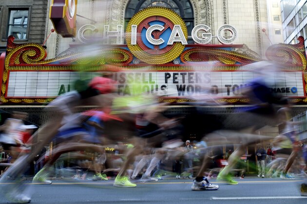 Runners participate in the Chicago Marathon in Chicago on Sunday, Oct. 12, 2014. Chicago's 37th annual race included a field of 108 elite men, women and wheelchair athletes. There were also 45,000 amateur runners registered and more than 1 million people were expected to watch along the way. (AP Photo/Nam Y. Huh)