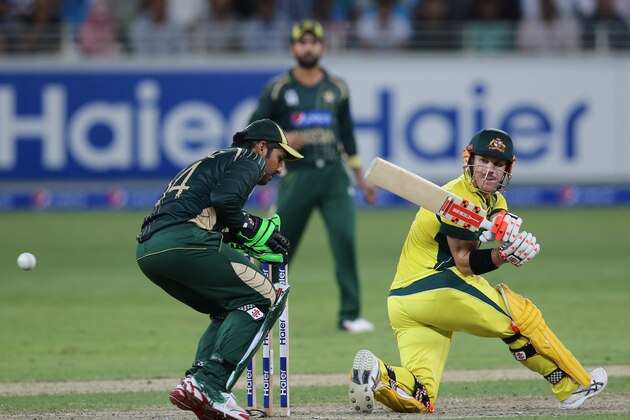 Australian batsman David Warner hits the ball during the second one day international match between Australia and Pakistan in Dubai, United Arab Emirates, Friday, Oct. 10, 2014. (AP Photo/Kamran Jebreili)