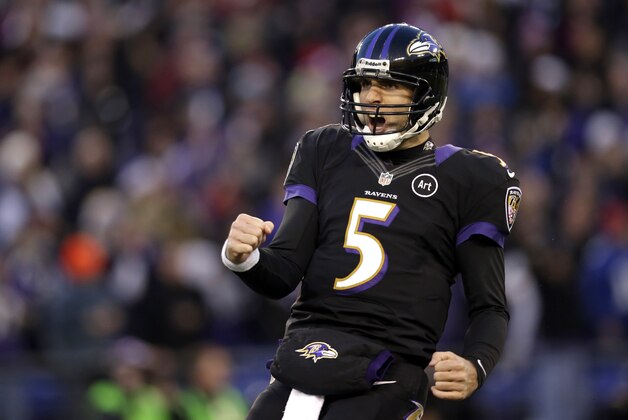 Baltimore Ravens quarterback Joe Flacco reacts after throwing a touchdown pass to wide receiver Torrey Smith in the first half of an NFL football game against the New York Giants in Baltimore, Sunday, Dec. 23, 2012. (AP Photo/Evan Vucci)