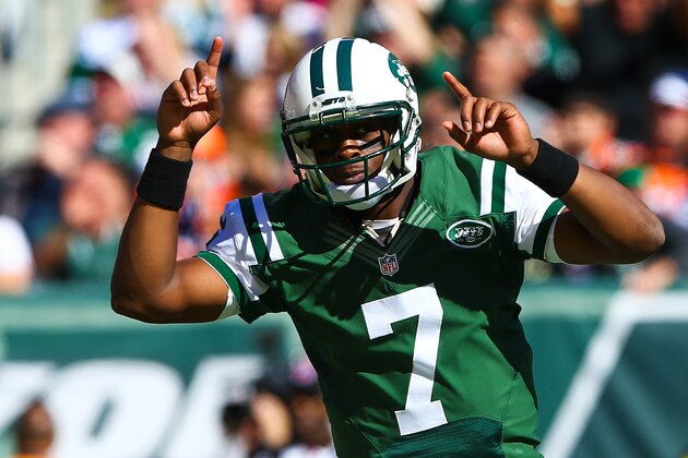 EAST RUTHERFORD, NJ - OCTOBER 12:  Geno Smith #7 of the New York Jets celebrates after throwing a touchdown pass to teammate Jace Amaro #88 in the first quarter during a game against the Denver Broncos at MetLife Stadium on October 12, 2014 in East Rutherford, New Jersey.  (Photo by Elsa/Getty Images)