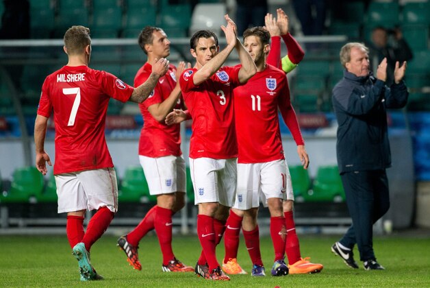 England's team players celebrate after scoring a goal during the Euro 2016 qualifying match between Estonia and England in Tallinn, Estonia, Sunday, Oct. 12, 2014. (AP Photo/Liis Treimann)
