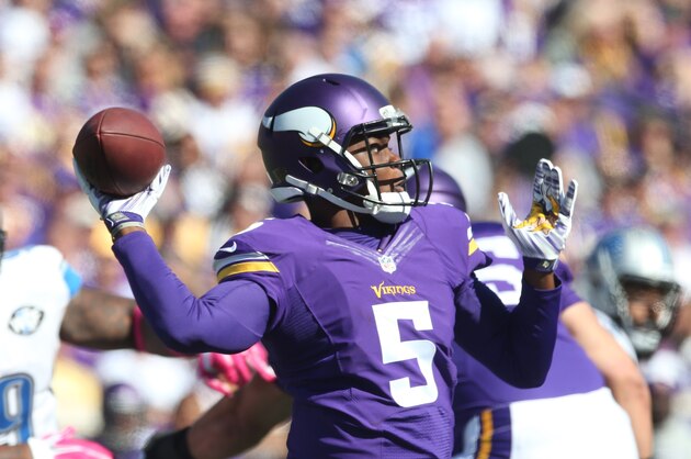 Minnesota Vikings quarterback Teddy Bridgewater throws downfield during the first half of an NFL football game against the Detroit Lions, Sunday, Oct. 12, 2014, in Minneapolis. (AP Photo/Jim Mone)