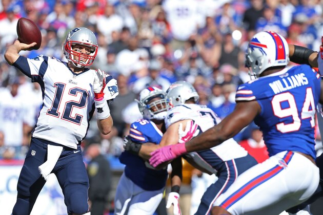 ORCHARD PARK, NY - OCTOBER 12:   Tom Brady #12 of the New England Patriots throws past Mario Williams #94 of the Buffalo Bills during the first half at Ralph Wilson Stadium on October 12, 2014 in Orchard Park, New York.  (Photo by Brett Carlsen/Getty Images)