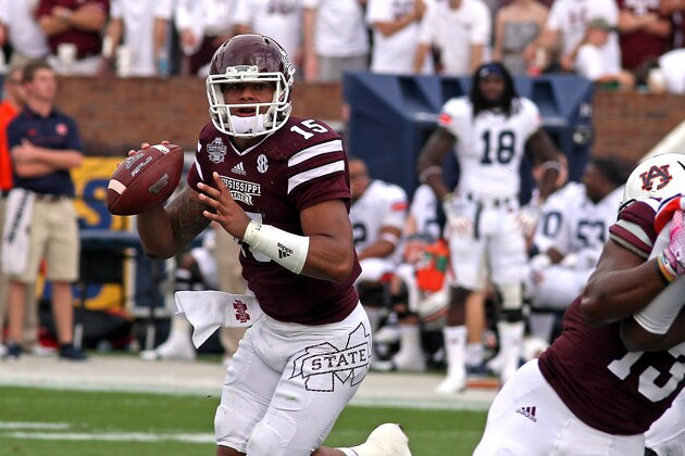 Mississippi State quarterback Dak Prescott (15) prepares to pass during the first half of an NCAA college football game against Auburn in Starkville, Miss., Saturday, Oct. 11, 2014. (AP Photo/Jim Lytle)