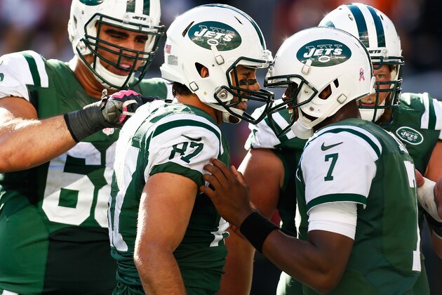 EAST RUTHERFORD, NJ - OCTOBER 12: Eric Decker #87 celebrates a touchdown with Geno Smith #7 of the New York Jets in the fourth quarter during a game against the Denver Broncos at MetLife Stadium on October 12, 2014 in East Rutherford, New Jersey.  (Photo by Jeff Zelevansky/Getty Images)