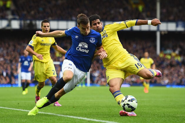 LIVERPOOL, ENGLAND - AUGUST 30:  Diego Costa of Chelsea tackles Seamus Coleman of Everton during the Barclays Premier League match between Everton and Chelsea at Goodison Park on August 30, 2014 in Liverpool, England.  (Photo by Laurence Griffiths/Getty Images)