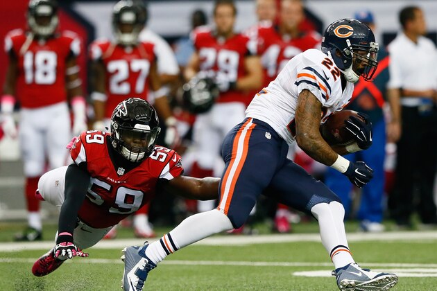 ATLANTA, GA - OCTOBER 12:  Matt Forte #22 of the Chicago Bears breaks a tackle by Joplo Bartu #59 of the Atlanta Falcons at Georgia Dome on October 12, 2014 in Atlanta, Georgia.  (Photo by Kevin C. Cox/Getty Images)
