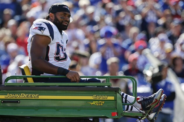 New England Patriots middle linebacker Jerod Mayo (51) is carted off the field after being injured on a play during the first half of an NFL football game against the Buffalo Bills, Sunday, Oct. 12, 2014, in Orchard Park, N.Y. (AP Photo/Mike Groll)