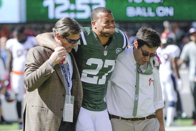 New York Jets cornerback Dee Milliner (27) is helped off the field with an ankle injury against the Denver Broncos in the first quarter of an NFL football game, Sunday, Oct. 12, 2014, in East Rutherford, N.J. (AP Photo/Bill Kostroun)