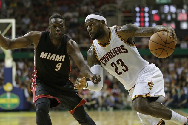 Cleveland Cavaliers' LeBron James, right, drives past Miami Heat's Luol Deng during a NBA preseason basketball game as part of the NBA Global Games, in Rio de Janeiro, Brazil, Saturday, Oct. 11, 2014. (AP Photo/Felipe Dana) Cleveland Cavaliers' LeBron James, right, drives past Miami Heat's Luol Deng during a NBA preseason basketball game as part of the NBA Global Games, in Rio de Janeiro, Brazil, Saturday, Oct. 11, 2014. (AP Photo/Felipe Dana)