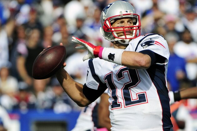 New England Patriots quarterback Tom Brady (12) passes against the Buffalo Bills during the second half of an NFL football game Sunday, Oct. 12, 2014, in Orchard Park, N.Y. (AP Photo/Gary Wiepert)